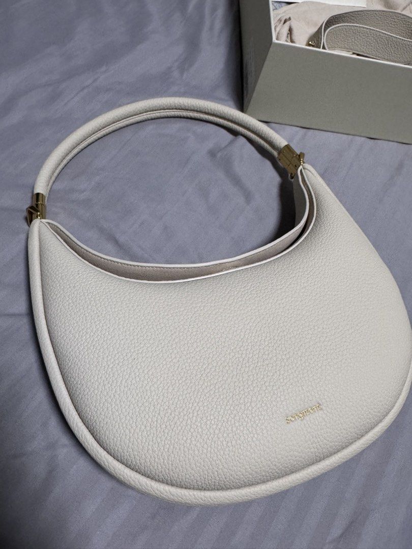 Songmont Luna Bag Cream Pebble Leather (Category: Shoulder Bags) located in Singapore. Submitted by jenray (Listing ID 1452475391, Image 2). Description: - Cream colored Songmont Luna bag - Pebble leather texture - Gold hardware details - Includes dust bag, box, shoulder strap and receipt - can be carried on shoulder and cross body. Can also be handheld - if you know bags, you would know this one - bought from Shanghai boutique .