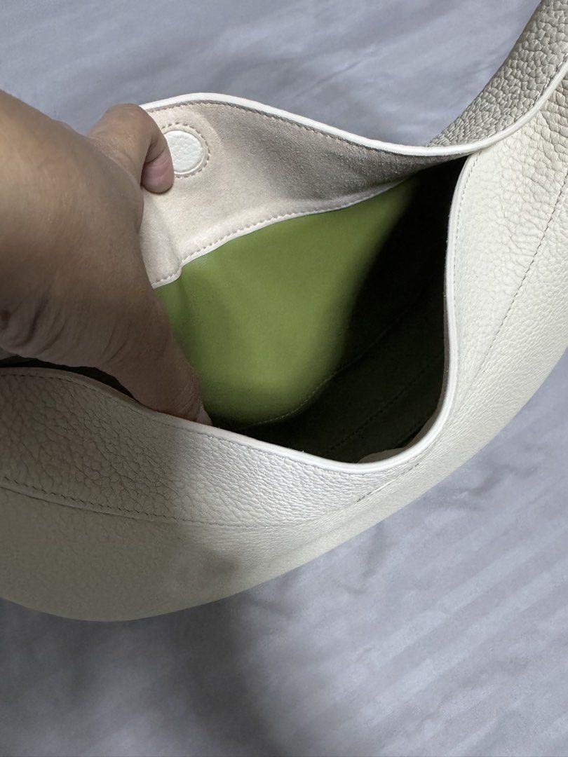 Songmont Luna Bag Cream Pebble Leather (Category: Shoulder Bags) located in Singapore. Submitted by jenray (Listing ID 1452475391, Image 7). Description: - Cream colored Songmont Luna bag - Pebble leather texture - Gold hardware details - Includes dust bag, box, shoulder strap and receipt - can be carried on shoulder and cross body. Can also be handheld - if you know bags, you would know this one - bought from Shanghai boutique .