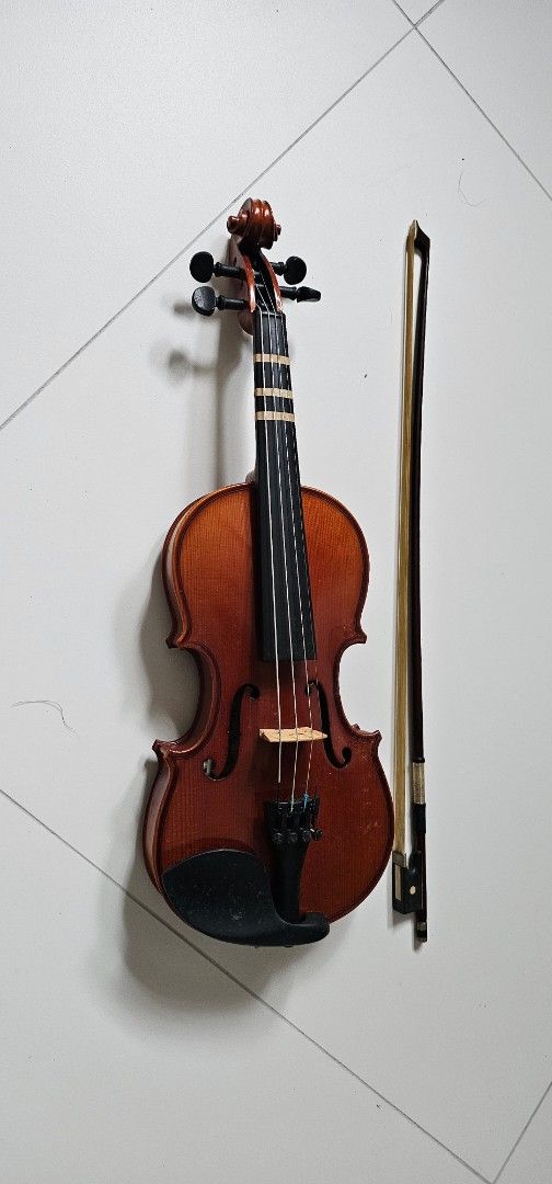 Violin with Bow (Category: Musical Instruments) located in Singapore. Submitted by 8888ckc (Listing ID 1452593075, Image 1). Description: - Violin with rich brown finish and 4 tuning pegs - Wooden bow with horsehair - Suitable for beginners and intermediate players - Ready for immediate use - Feel free to ask questions only deal at AMK MRT Station or AMK HUB Bus interchange or my block opp AMK MRT Station if you are driving surface looks like new