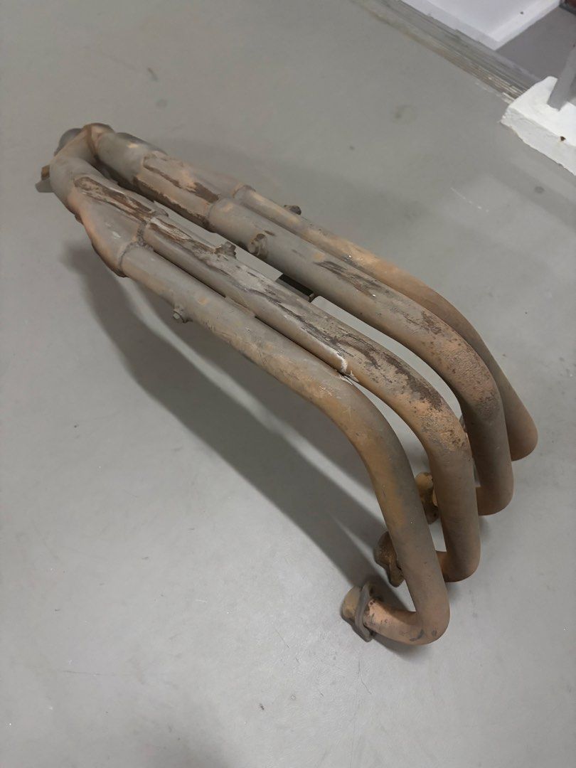 Cb400 spec 3 yoshimura exhaust (Category: Motorcycle Accessories) located in Singapore. Submitted by haresh7_ (Listing ID 1447456755, Image 5). Description: - Yoshimura Cyclone exhaust set (muffler and headers) - Made in Japan - Part number YHA001618 visible - Muffler features a blue tint - Sold as a complete set $300 for exhaust $100 for header Installation with labour fee.
