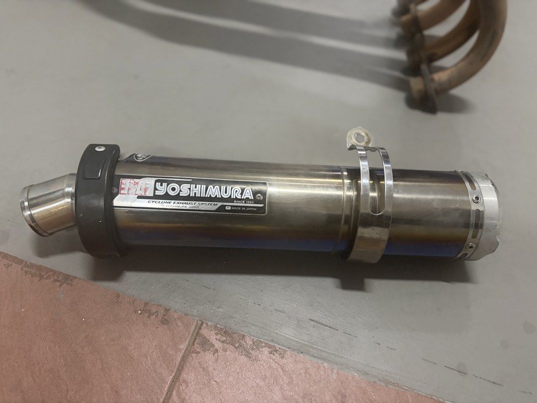 Cb400 spec 3 yoshimura exhaust (Category: Motorcycle Accessories) located in Singapore. Submitted by haresh7_ (Listing ID 1447456755, Image 3). Description: - Yoshimura Cyclone exhaust set (muffler and headers) - Made in Japan - Part number YHA001618 visible - Muffler features a blue tint - Sold as a complete set $300 for exhaust $100 for header Installation with labour fee.