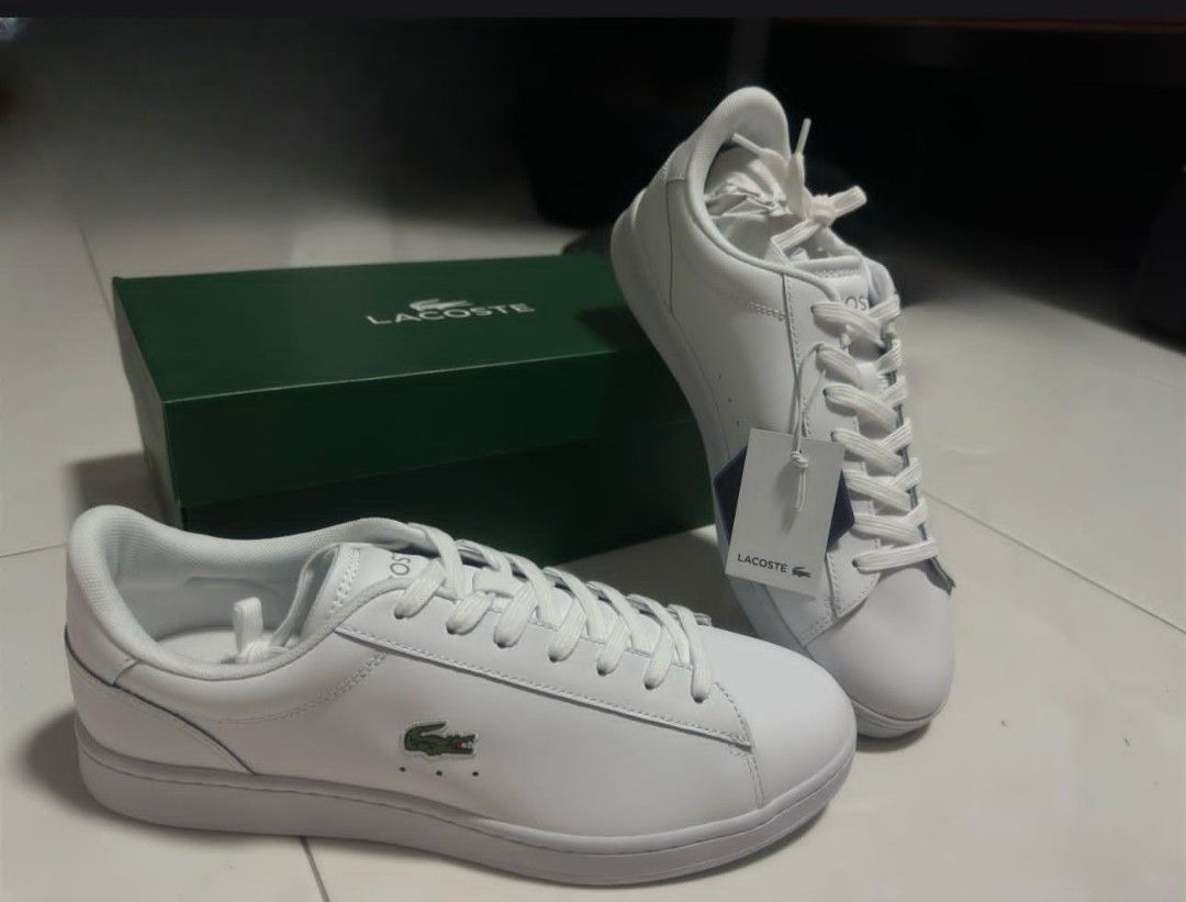 Lacoste White Leather Sneakers with Box (Category: Sneakers) located in Singapore. Submitted by m.zul.0.0 (Listing ID 1447627657, Image 1). Description: - Classic white leather sneakers - Iconic Lacoste crocodile logo on side and heel - Includes original Lacoste box - Size: UK 9 / EUR 43 / US 10 - Ideal for everyday wear -Never wear once -meetup not available on Fri/Sat/Sun .