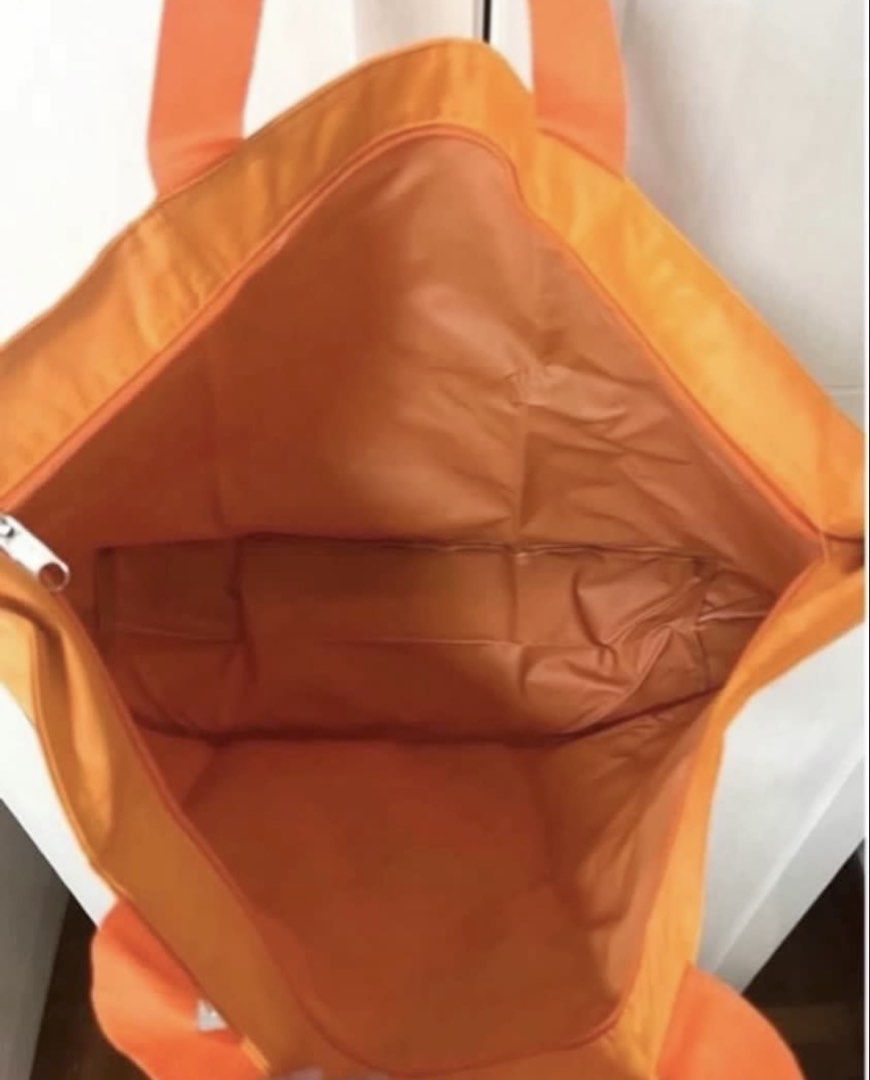 Orange Nylon Tote Bag (new) (Category: Tote Bags) located in Singapore. Submitted by wallis1 (Listing ID 1447763588, Image 4). Description: Brand new 52x32x15cm With base Durable nylon material Secure zipper main compartment Internal pockets for organisation Water resistant Comfortable fabric handles .