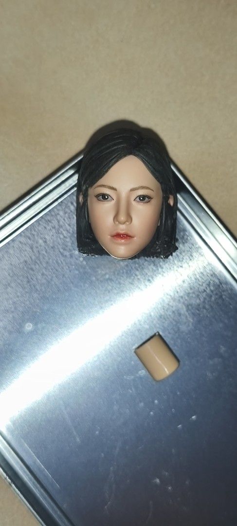 1/6 Scale Female Head Sculpt with Neck Joint (Category: Toy Figures) located in Singapore. Submitted by crayon-elephant (Listing ID 1448014303, Image 1). Description: - 1/6 scale female head sculpt - Realistic facial features - Black hair - Includes neck joint piece - Ideal for action figure customization - Suitable for collectors.