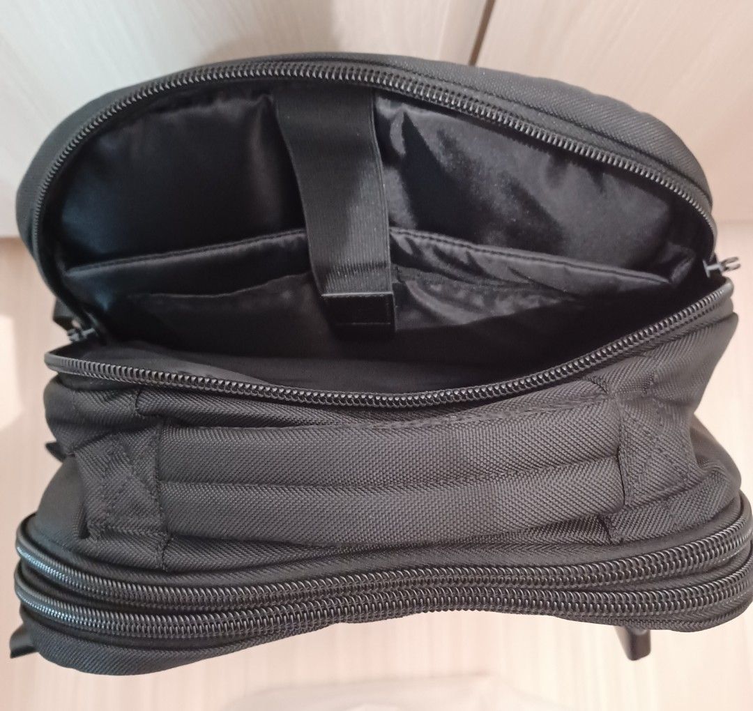 Black Travel Backpack (Category: Backpacks) located in Singapore. Submitted by j_heaven (Listing ID 1447985976, Image 4). Description: - Black backpack - Opens fully like a suitcase - Padded straps for comfort - Multiple pockets (inside & out) - Ideal for travel or everyday use - Sturdy zippers.