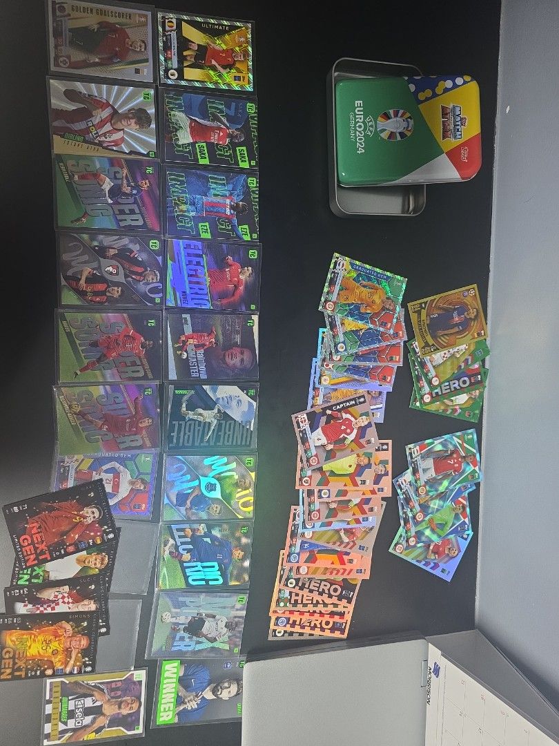 Panini UEFA EURO 2024 cards. We got ronaldo, purple guler,kdb, Bellingham,saka,eze and alot of bulk (Category: Raw Cards) located in Singapore. Submitted by jayden.chuadr09 (Listing ID 1448003380, Image 1). Description: - Panini UEFA EURO 2024 cards - Includes official tin - Many individual cards included - Features shiny and special edition cards all for 20 (e.g., 'Hero', 'Next Gen') - Ideal for football fans and collectors of the EURO 2024 tour