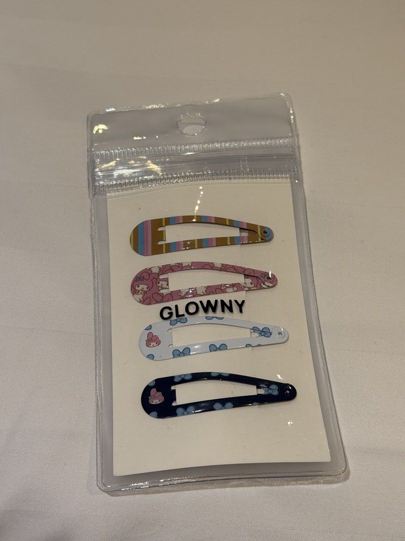 Sanrio Glowny My Melody Hair Clip Set (Multi) (Category: Hair Accessories) located in Singapore. Submitted by icevanillalatte (Listing ID 1448426440, Image 1). Description: - Set of 4 My Melody hair clips - Features different cute designs - Official Glowny x Sanrio collaboration - Adds a fun touch to hairstyles - Ideal for My Melody fans.