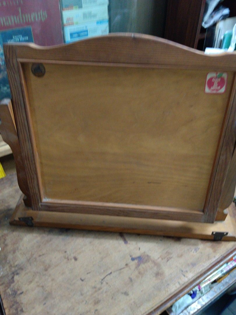 Wooden Shelf Unit - Solid Wood Mirror Display Stand (Category: Other Home Decor) located in Singapore. Submitted by mypassionlisbon (Listing ID 1453053342, Image 5). Description: - Solid wood Mirror shelf unit - Natural wood grain finish - Sturdy construction - Versatile: display items or use as a small stand - Shows minor signs of wear - Approx. 20 inches tall - Ready for a new home Can stand or hang on wall..