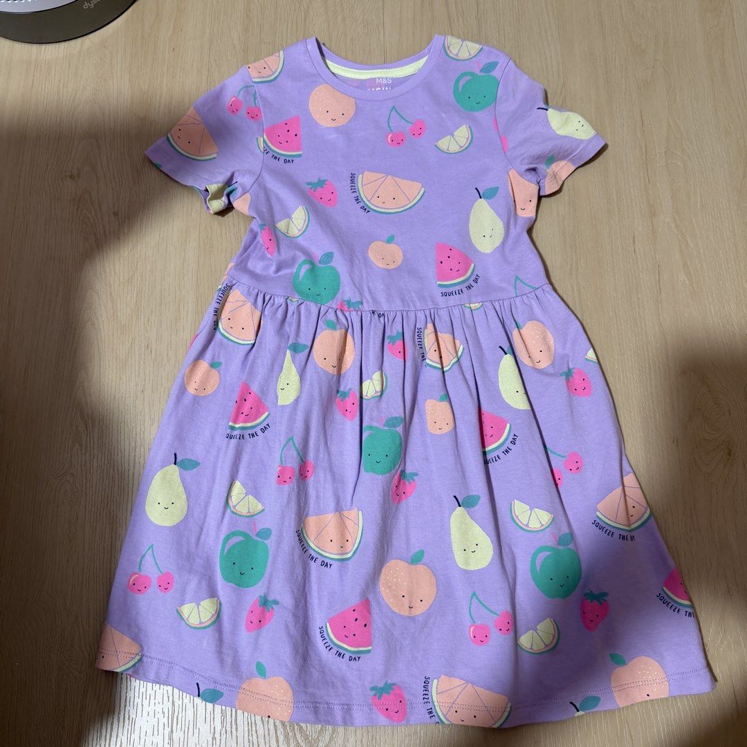 (4 for $10) Marks & Spencer Bundle of 4 Girls' Dresses - Unicorn, Dinosaur, Fruit, Ice Cream (6-7 years) (Category: Babies & Kids Fashion) located in Singapore. Submitted by robinsparkless (Listing ID 1454842940, Image 5). Description: - Set of 4 adorable dresses for girls. - Designs include: Purple Unicorn, Pink Ice Cream, Cream Dinosaur, Purple Fruit. - Sleeve types: Unicorn & Dinosaur (long sleeve), Ice Cream & Fruit (short sleeve). - Ideal fo