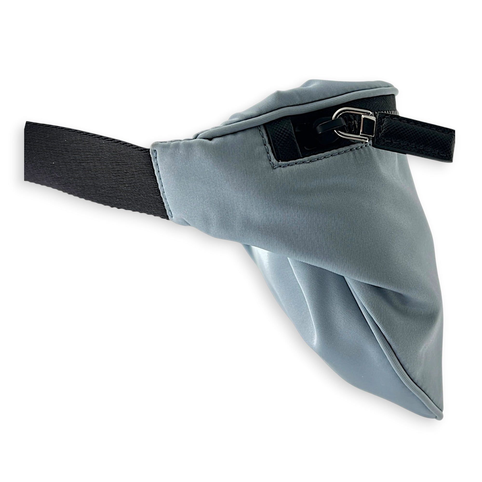 Prada Logo Belt Bag Blue in Nylon, Silver hardware (Category: Bags & Wallets) located in Singapore. Submitted by carousellluxury (Listing ID 1433830147, Image 4). Description: SKU C2604-011342AA Material Nylon Color Blue Hardware Silver Strap Included, non-detachable Dimension (L)20cm x (H)16cm x (W)1cm Accessories Dust Bag, Series 250 Circa Est NA Microchipped FALSE Condition - Surface: In very good condition overall - Bottom Edge / Base / Bagfe