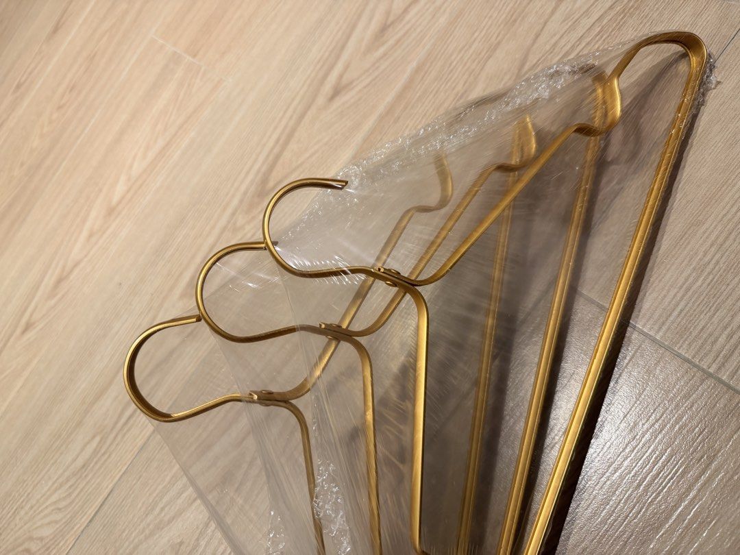 BN Gold Metal Hangers (Set of 10) (Category: Hooks & Hangers) located in Singapore. Submitted by sunevenings (Listing ID 1456352063, Image 1). Description: - Set of 10 BN gold metal hangers - Individually wrapped in plastic - Strong and durable construction - Ideal for CAPSULE wardrobes, or just to organise suits, dresses, and cardigans etc.