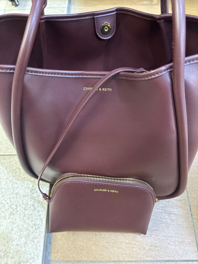 (GOOD BUY) Charles and Keith Lyla Tubular Slouchy Tote Bag - Mulberry Plum (Category: Tote Bags) located in Singapore. Submitted by christinaloo9 (Listing ID 1456281116, Image 1). Description: - Selling about less than half of retail - NO cracks NO peeling of leather - No packaging included Product information: https://www.charleskeith.com/sg/CK2-30781483_ML.PLM.html?ampv=gallery-no-video-treatment.