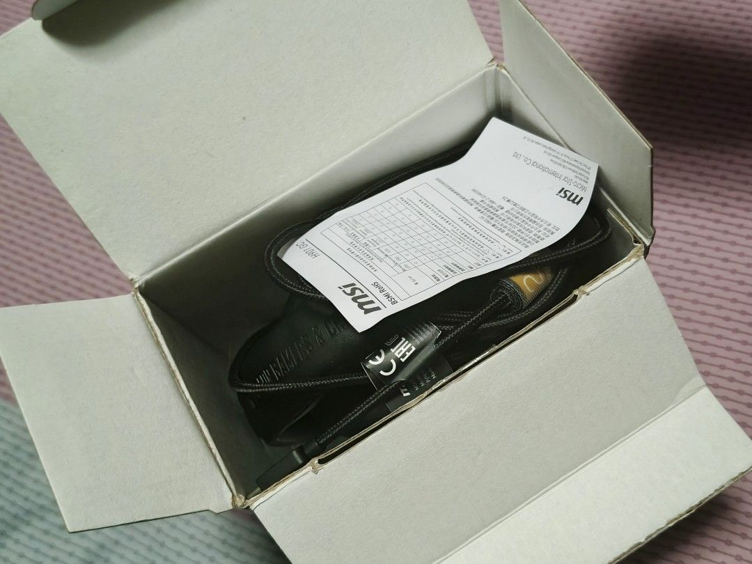 Gaming headset headphone (Category: Headphones & Headsets) located in Singapore. Submitted by ben-10 (Listing ID 1444781037, Image 4). Description: I used this headset for twice only then keep it as I continue to use my old headset. - Condition like new. - MSI H901 GC 20th Anniversary Gaming Headset - USB-C connection for wide compatibility - Ergonomic design with adjustable headband - Soft ear cups for comfort - Hidden microphone - 7.1 Surround 