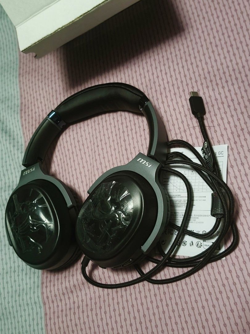Gaming headset headphone (Category: Headphones & Headsets) located in Singapore. Submitted by ben-10 (Listing ID 1444781037, Image 2). Description: I used this headset for twice only then keep it as I continue to use my old headset. - Condition like new. - MSI H901 GC 20th Anniversary Gaming Headset - USB-C connection for wide compatibility - Ergonomic design with adjustable headband - Soft ear cups for comfort - Hidden microphone - 7.1 Surround 