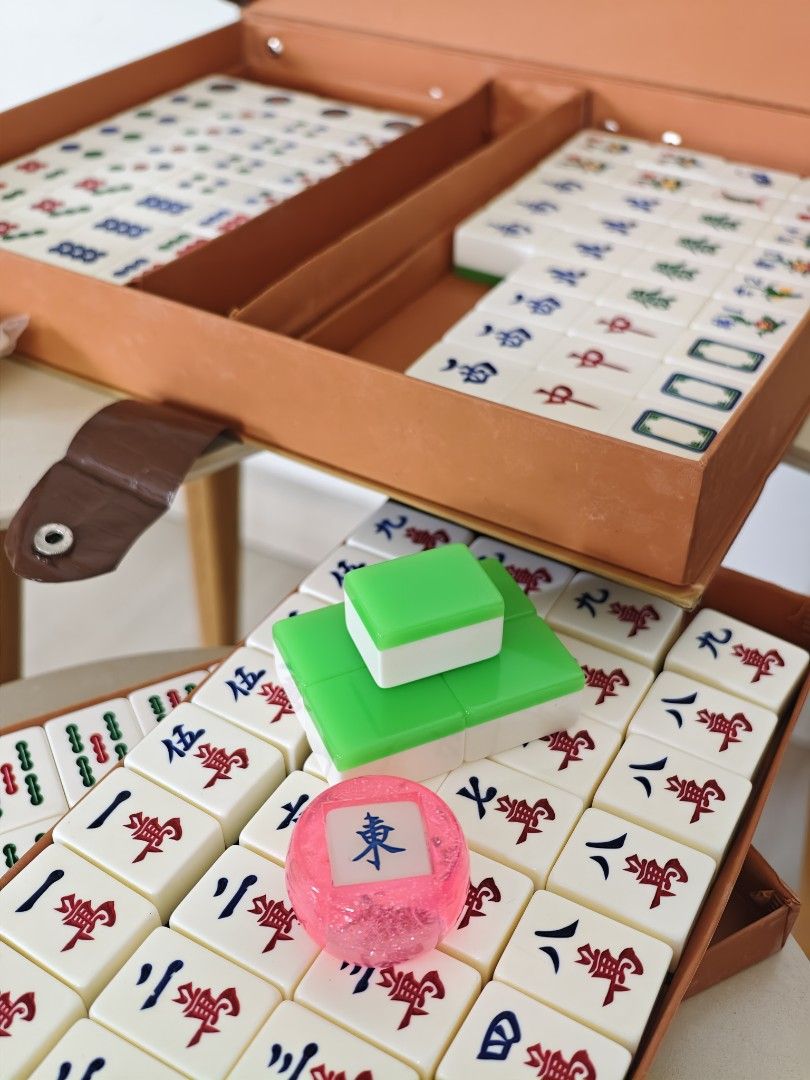 Pre-loved classic mahjong set (Category: Board Games & Puzzles) located in Singapore. Submitted by spymaster (Listing ID 1456869580, Image 1). Description: - Classic mahjong set with carrying case - Light green tiles - Includes dices and chips - Excludes joker tiles.