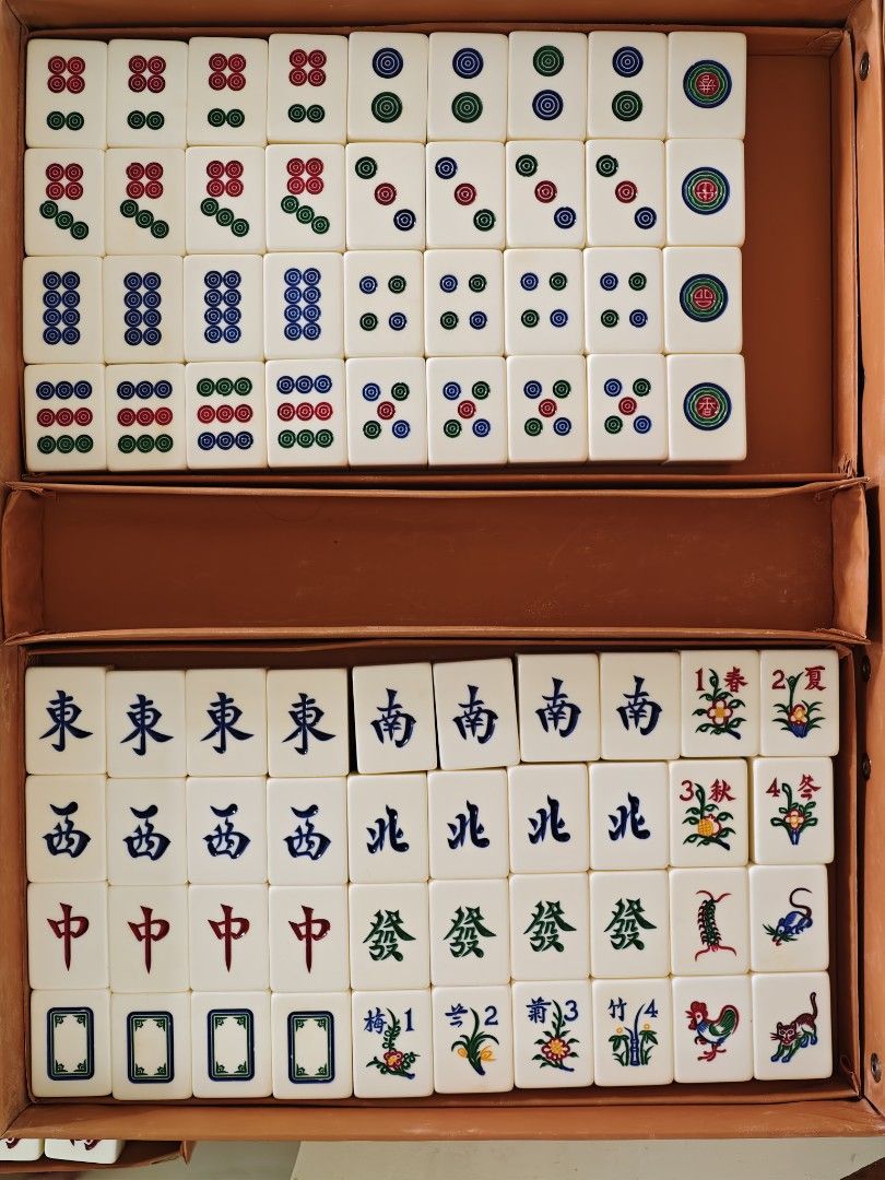 Pre-loved classic mahjong set (Category: Board Games & Puzzles) located in Singapore. Submitted by spymaster (Listing ID 1456869580, Image 2). Description: - Classic mahjong set with carrying case - Light green tiles - Includes dices and chips - Excludes joker tiles.