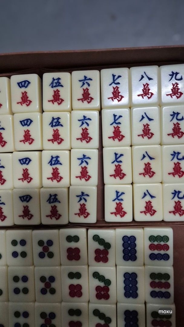 Vintage Mahjong Set with Case (Category: Board Games & Puzzles) located in Singapore. Submitted by everlasting.used (Listing ID 1456888567, Image 5). Description: - Complete Mahjong set - Brown faux leather case with snap closure and handle - Includes all tiles for a standard game - Durable tiles with clear markings - Perfect for game nights or as a decorative item - Pls note some tiles slight yellowish.
