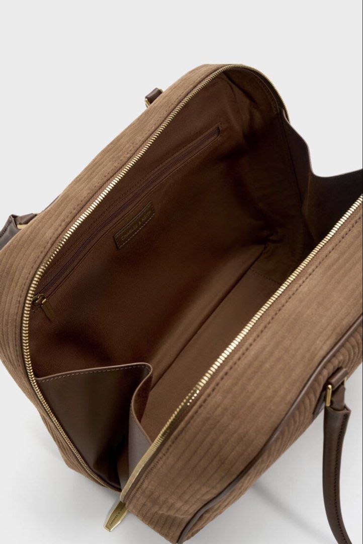 🩷 Charles & Keith Brown Shoulder Bag Laptop Friendly (Category: Shoulder Bags) located in Singapore. Submitted by pinksands (Listing ID 1457044773, Image 3). Description: - Brand: Charles & Keith - Material: Brown Leather Light Weight - Closure: Zip - Handles: Two top handles - Interior: Zip pocket - Style: Classic, great for everyday use - Versatility: Matches with many outfits - Laptop: It could fit Laptop and easy to carry for school or work 