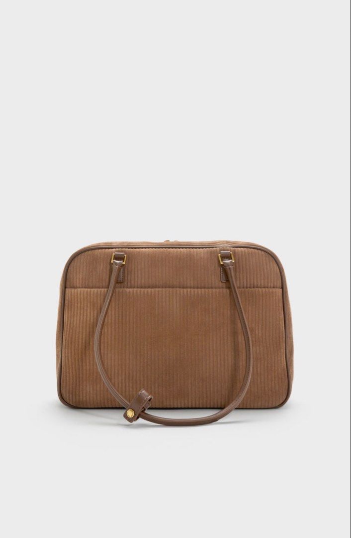 🩷 Charles & Keith Brown Shoulder Bag Laptop Friendly (Category: Shoulder Bags) located in Singapore. Submitted by pinksands (Listing ID 1457044773, Image 2). Description: - Brand: Charles & Keith - Material: Brown Leather Light Weight - Closure: Zip - Handles: Two top handles - Interior: Zip pocket - Style: Classic, great for everyday use - Versatility: Matches with many outfits - Laptop: It could fit Laptop and easy to carry for school or work 