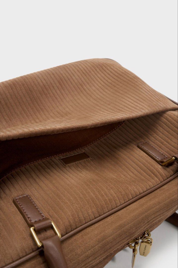 🩷 Charles & Keith Brown Shoulder Bag Laptop Friendly (Category: Shoulder Bags) located in Singapore. Submitted by pinksands (Listing ID 1457044773, Image 4). Description: - Brand: Charles & Keith - Material: Brown Leather Light Weight - Closure: Zip - Handles: Two top handles - Interior: Zip pocket - Style: Classic, great for everyday use - Versatility: Matches with many outfits - Laptop: It could fit Laptop and easy to carry for school or work 