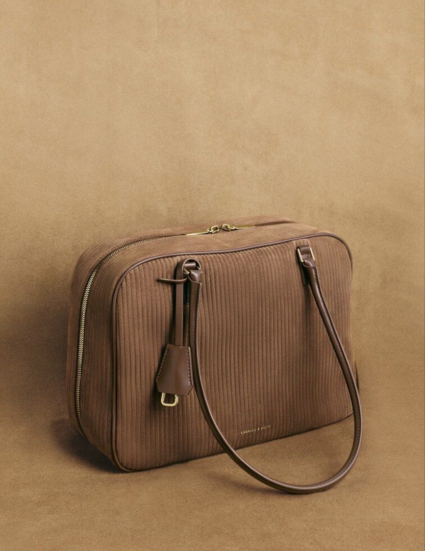 🩷 Charles & Keith Brown Shoulder Bag Laptop Friendly (Category: Shoulder Bags) located in Singapore. Submitted by pinksands (Listing ID 1457044773, Image 1). Description: - Brand: Charles & Keith - Material: Brown Leather Light Weight - Closure: Zip - Handles: Two top handles - Interior: Zip pocket - Style: Classic, great for everyday use - Versatility: Matches with many outfits - Laptop: It could fit Laptop and easy to carry for school or work 