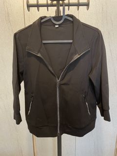 Black jacket with zipper pockets