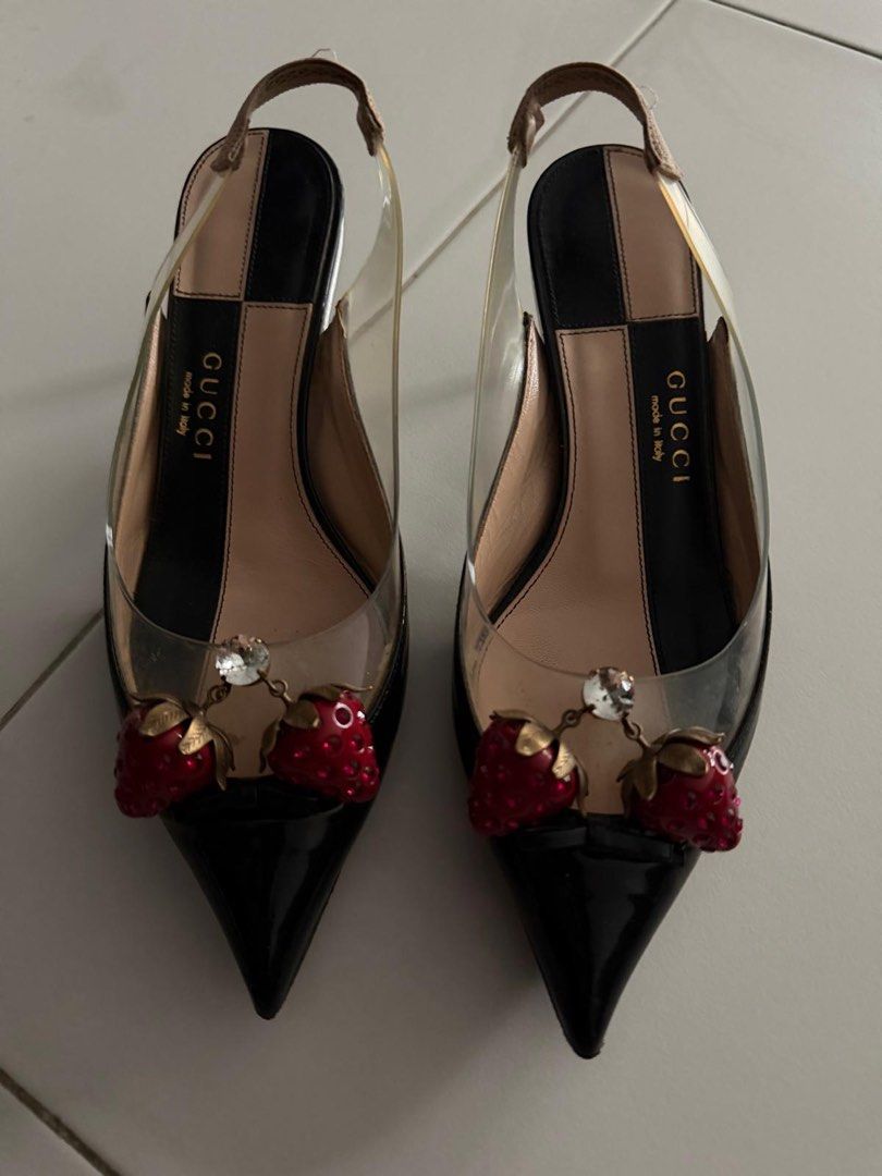 Gucci Slingback Heels with Strawberry Detail (Category: Heels) located in Singapore. Submitted by cheminologist (Listing ID 1456954955, Image 1). Description: - Gucci slingback heels - Black patent leather with clear PVC sides - Adorable strawberry charm with crystal accents at the toe - Moderate heel height - Made in Italy - Size: 35 1/2 Price negotiable. Pick up only..