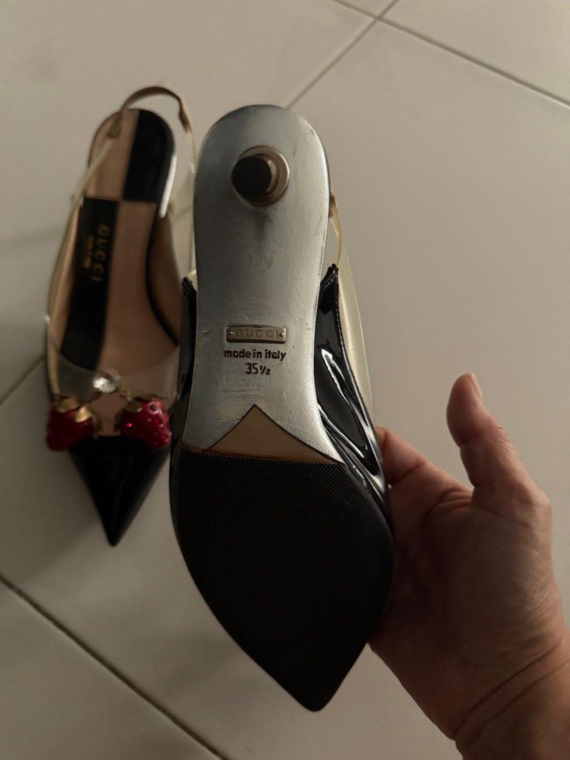 Gucci Slingback Heels with Strawberry Detail (Category: Heels) located in Singapore. Submitted by cheminologist (Listing ID 1456954955, Image 2). Description: - Gucci slingback heels - Black patent leather with clear PVC sides - Adorable strawberry charm with crystal accents at the toe - Moderate heel height - Made in Italy - Size: 35 1/2 Price negotiable. Pick up only..