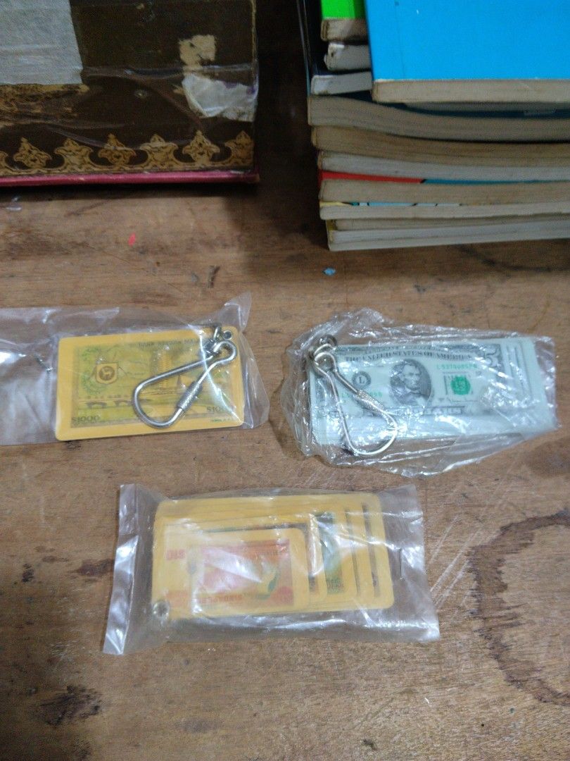Malaysia & Singapore Currency Souvenir Keychains (Category: Handmade Craft) located in Singapore. Submitted by mypassionlisbon (Listing ID 1457144606, Image 1). Description: - Set of 3 souvenir keychains - Features Malaysian Ringgit note - Features Singapore Dollar note - Includes a third currency note keychain USA - All keychains are in protective plastic packaging - Perfect for collectors or as a unique gift. Singapore keychain:$ 28. .