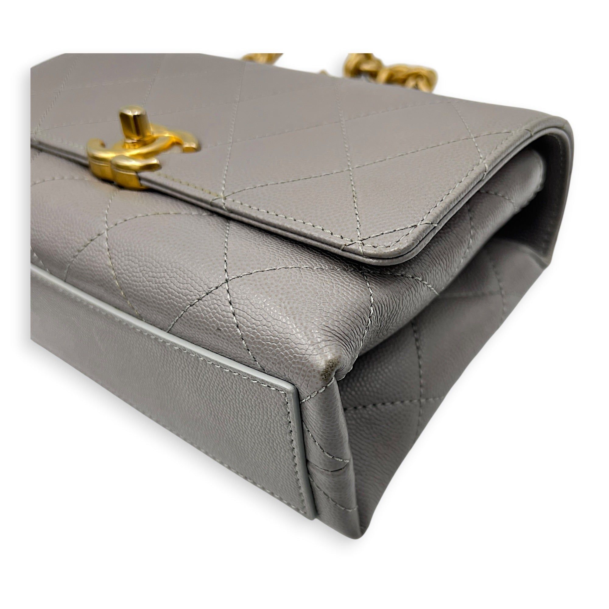 Chanel CC Flap Chain Mini Grey Shoulder Bag in Caviar Leather, Gold hardware (Category: Bags & Wallets) located in Singapore. Submitted by carousellluxury (Listing ID 1457428742, Image 7). Description: SKU S2607-013274AN Material Caviar Leather Size Mini Color Grey Hardware Gold Strap Included, non-detachable Dimension (L)20cmx(H)13cmx(W)6cm Accessories Dust Bag, Original Box, Receipt(s), Care Card, Series NJKH6L72 Circa Est 2021 Microchipped TRU