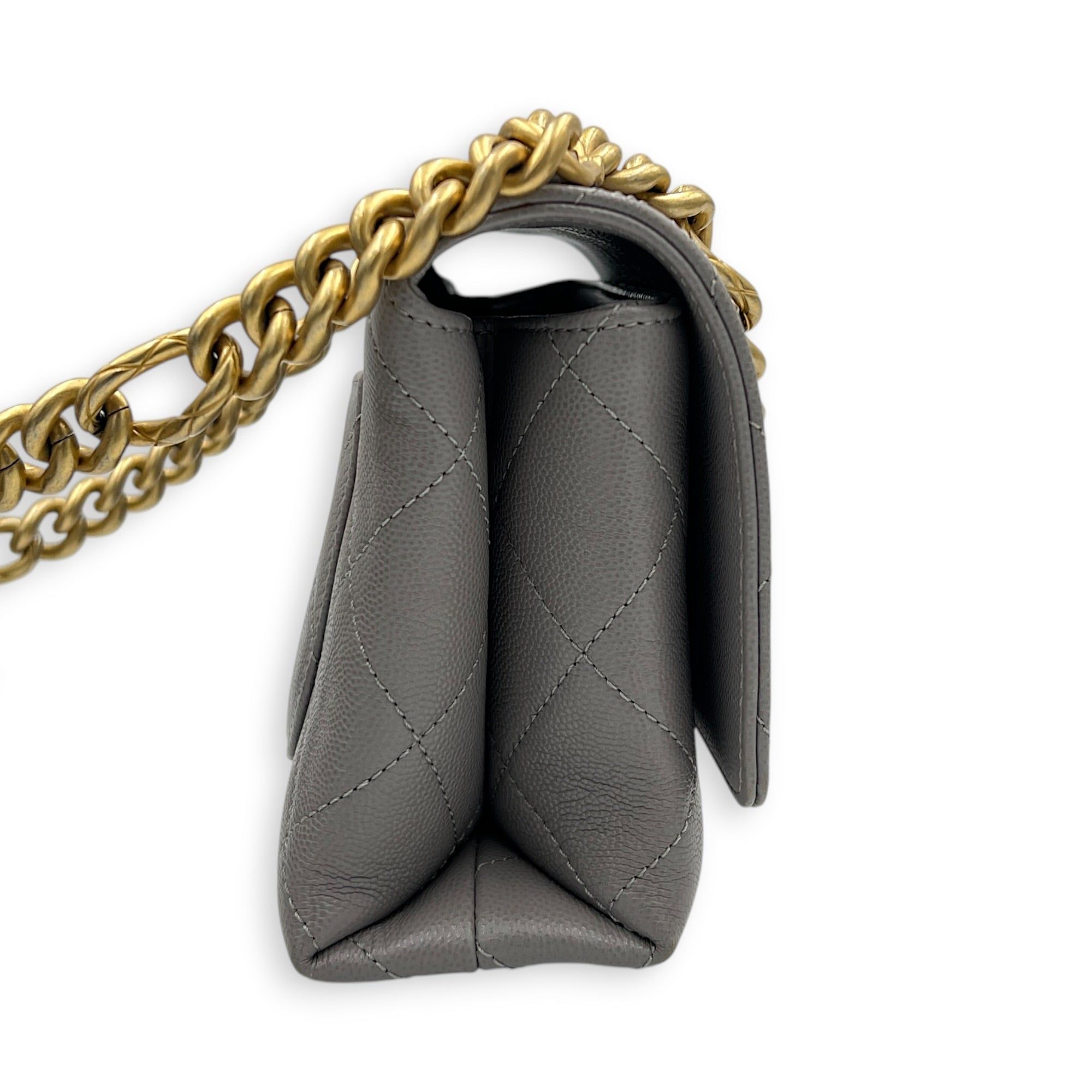 Chanel CC Flap Chain Mini Grey Shoulder Bag in Caviar Leather, Gold hardware (Category: Bags & Wallets) located in Singapore. Submitted by carousellluxury (Listing ID 1457428742, Image 3). Description: SKU S2607-013274AN Material Caviar Leather Size Mini Color Grey Hardware Gold Strap Included, non-detachable Dimension (L)20cmx(H)13cmx(W)6cm Accessories Dust Bag, Original Box, Receipt(s), Care Card, Series NJKH6L72 Circa Est 2021 Microchipped TRU