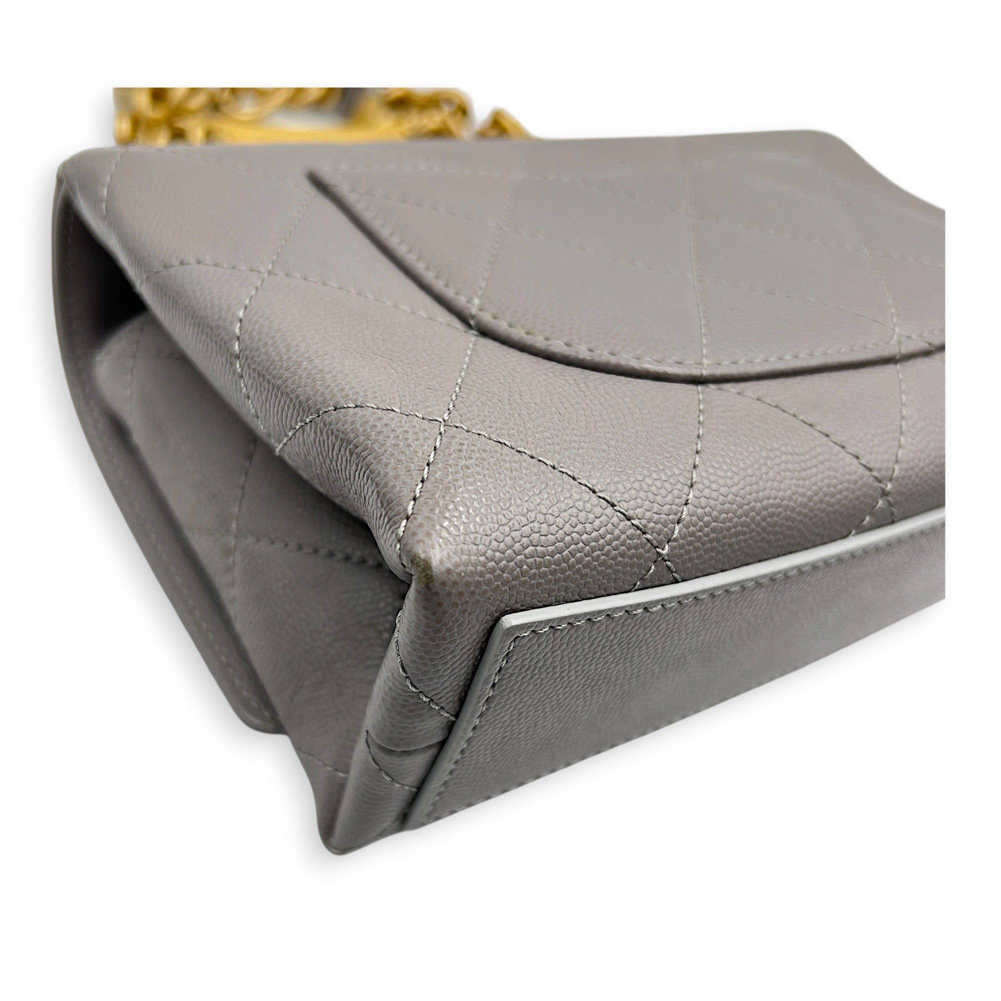 Chanel CC Flap Chain Mini Grey Shoulder Bag in Caviar Leather, Gold hardware (Category: Bags & Wallets) located in Singapore. Submitted by carousellluxury (Listing ID 1457428742, Image 8). Description: SKU S2607-013274AN Material Caviar Leather Size Mini Color Grey Hardware Gold Strap Included, non-detachable Dimension (L)20cmx(H)13cmx(W)6cm Accessories Dust Bag, Original Box, Receipt(s), Care Card, Series NJKH6L72 Circa Est 2021 Microchipped TRU