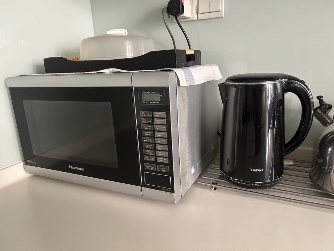 Panasonic Microwave Oven & Tefal Kettle Set (Category: Ovens & Toasters) located in Singapore. Submitted by namratar (Listing ID 1457360754, Image 1). Description: - Panasonic Microwave Oven (Model NN-ST651M) with Inverter Technology - Black Tefal Electric Kettle (Standard Model) - Both items are in good working condition, microwave light not working. Otherwise in great working condition. - Perfect for everyday kitchen use - Selling as a convenie