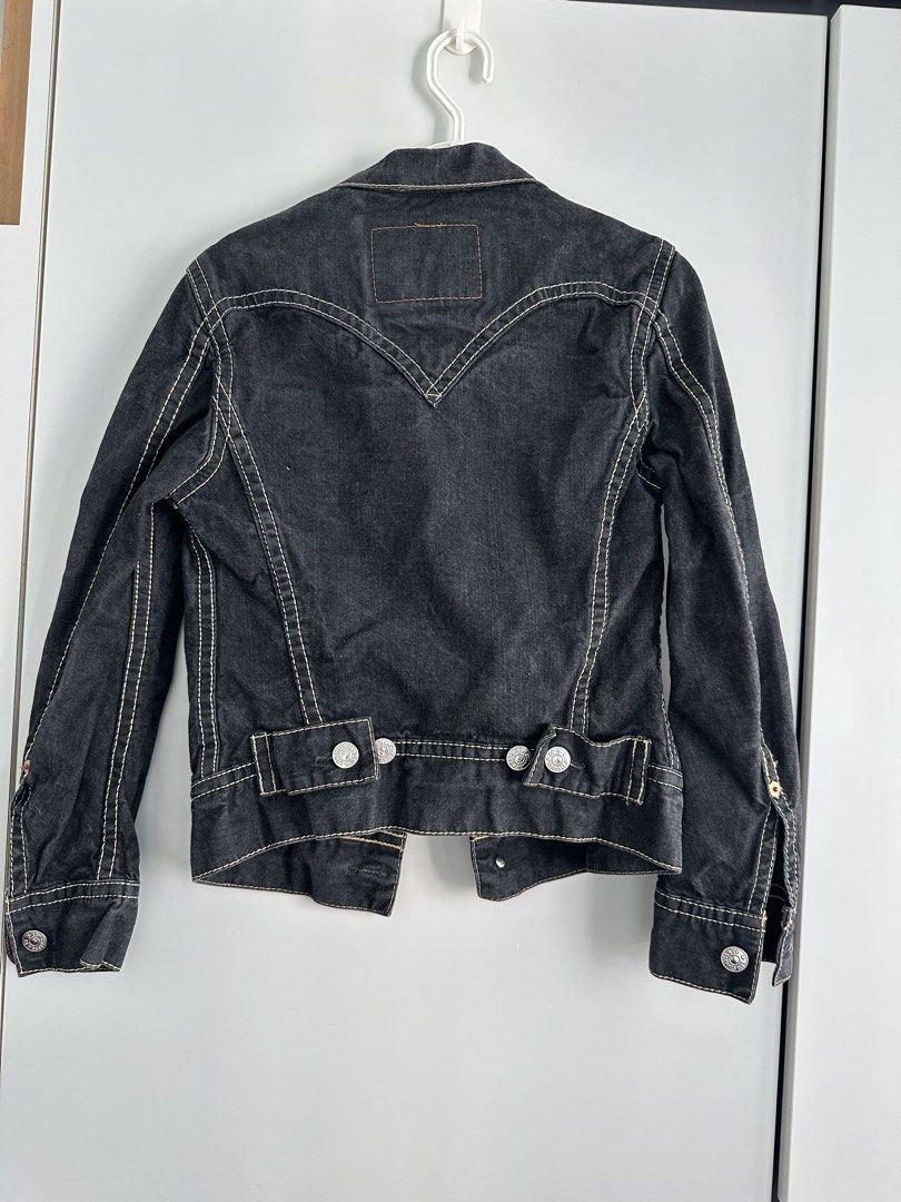 Vintage Levi's Denim Trucker Jacket (Category: Coats, Jackets and Outerwear) located in Singapore. Submitted by heleofrost (Listing ID 1457402745, Image 1). Description: - Classic black Levi's denim trucker jacket - Iconic V-stitch detailing on back and chest pockets - Button closure - Adjustable waist tabs - Versatile staple piece for any wardrobe.