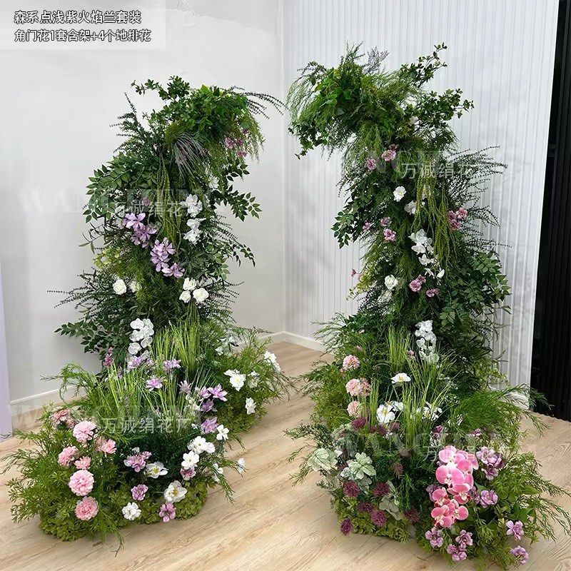 Wedding floral decor setup <USED ONCE> (Category: Artificial Plants & Flowers) located in Singapore. Submitted by daintystudio (Listing ID 1457541034, Image 1). Description: - Beautiful forest-style arch decoration - Features light purple orchids and white flowers - Set includes: 1 arch with frame, 8floor flower arrangements, 1 table flower arrangement for reception - Perfect for weddings, events, and stage decor - Creates a natural and romantic 
