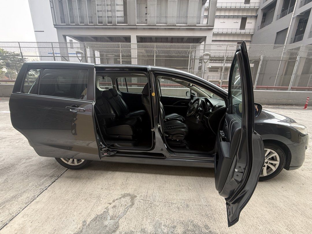 Mazda 5 Sunroof 7 Seater MPV for RENT / LEASE / GRAB / PHV (Category: Car Rental) located in Singapore. Submitted by spherecarsleasing (Listing ID 1457594786, Image 4). Description: Mazda 5 7-Seater 🚐 ✔ Sliding doors – easy entry/exit ✔ Spacious for passengers or cargo ✔ Smooth & fuel-efficient drive ✔ Ideal for PHV / family use ✅ Low Deposit Amount ✅ 24hr Towing Service & Assistance ✅ Unlimited Mileage Packages Included: 🚙 Servicing & Maintena