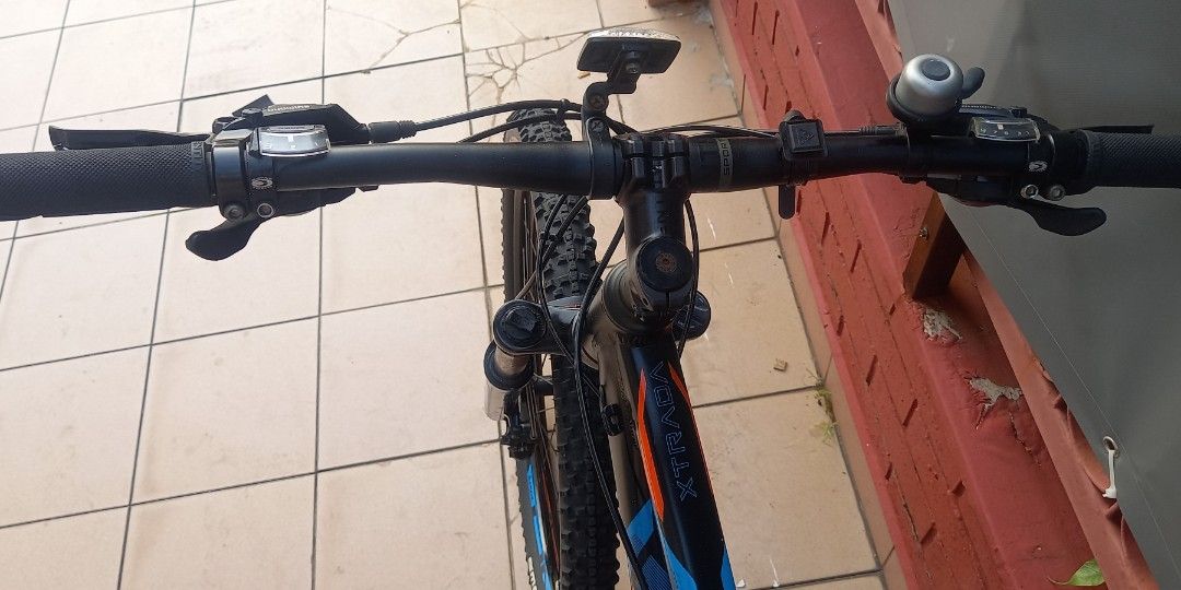 Polygon Xtrada Mountain Bike S size 27.5" (Category: Bicycles) located in Singapore. Submitted by tahamid21676972 (Listing ID 1456898477, Image 8). Description: - Polygon Xtrada Mountain Bike - Colour: Black frame with orange and blue accents - Gears: Shimano - Brakes: Front and rear disc brakes - Tires: Schwalbe - Accessories: Water bottle cage included - Condition: Ready for your next trail adventure.