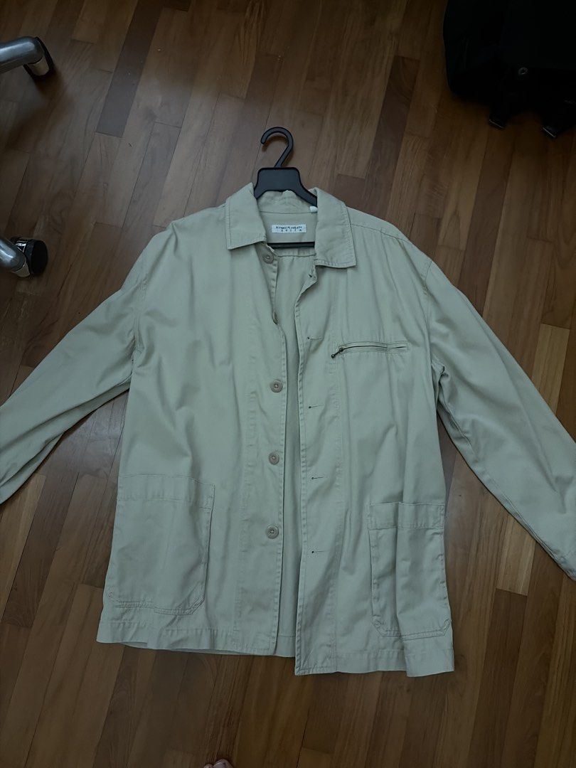 Hiromichi Nakano Golf Beige Jacket Size 2L (Category: Coats, Jackets and Outerwear) located in Singapore. Submitted by simwenjie (Listing ID 1457852175, Image 1). Description: - Brand: Hiromichi Nakano Golf - Color: Beige - Size: 2L - Closure: Button-up front - Pockets: 1 zippered chest pocket, 2 large bottom pockets - Collar: Classic - Style: Suitable for casual wear or layering.