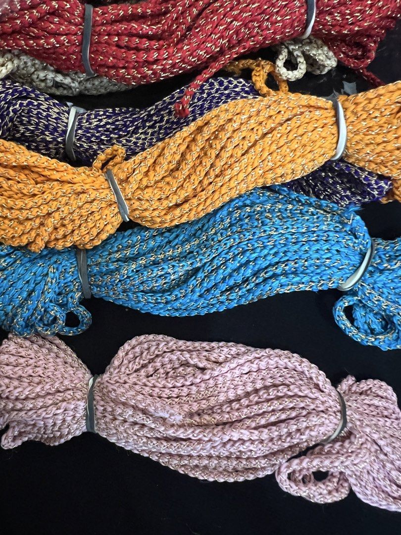 Sparkly Craft Rope Bundles - Assorted Colors (Category: Craft Supplies & Tools) located in Singapore. Submitted by nuzfs (Listing ID 1457775772, Image 1). Description: - Sparkly craft rope bundles - Perfect for DIY projects, decorations, and gift wrapping - Available colors: Red, Purple, Orange, Blue, Pink - Bundles tied with silver bands - Some still in original plastic packaging - Ample material for all your crafting needs.