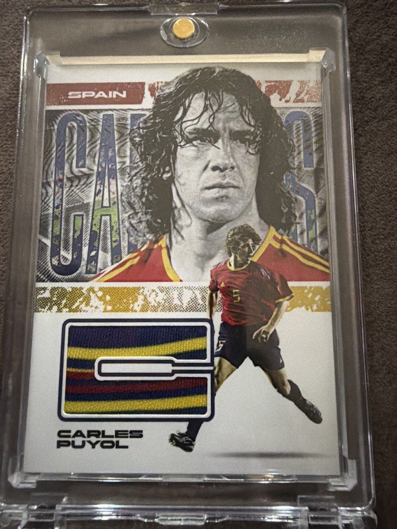 Carles Puyol Futera Jersey Relic Card 05/05 (Category: Raw Cards) located in Singapore. Submitted by dharma_22 (Listing ID 1458006299, Image 1). Description: • Serial numbered 05/05 (only 5 made in the world) • Features an authentic piece of FC Barcelona Legends training-worn jersey from a 2025 match • Beautiful multi-colour jersey patch (Barça colours) • Card is in excellent condition and comes in a protective case This is a very limited low-num