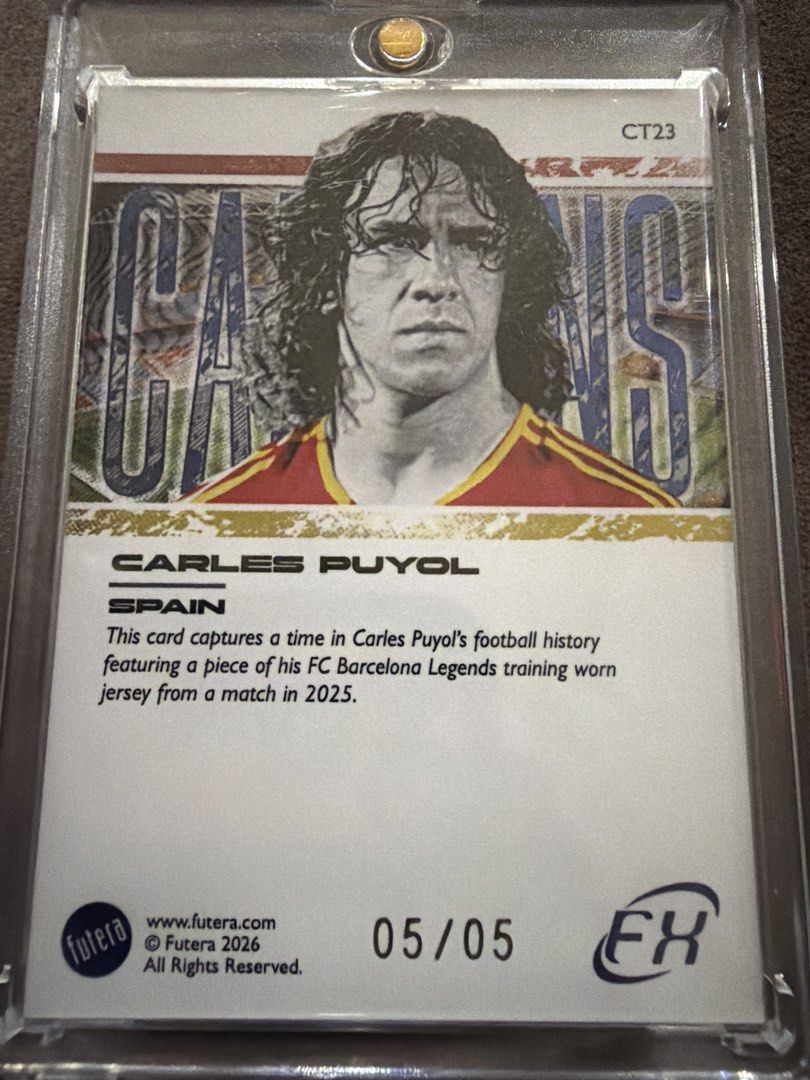 Carles Puyol Futera Jersey Relic Card 05/05 (Category: Raw Cards) located in Singapore. Submitted by dharma_22 (Listing ID 1458006299, Image 2). Description: • Serial numbered 05/05 (only 5 made in the world) • Features an authentic piece of FC Barcelona Legends training-worn jersey from a 2025 match • Beautiful multi-colour jersey patch (Barça colours) • Card is in excellent condition and comes in a protective case This is a very limited low-num