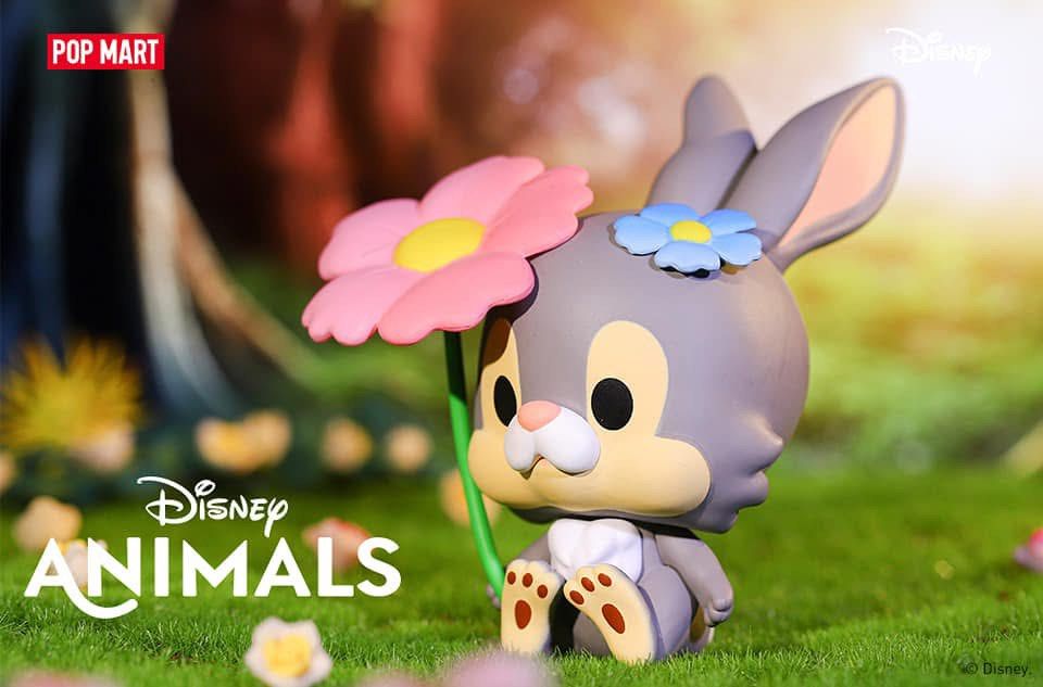 Disney POP MART Thump Blind Box Figure (Category: Designer & Blind Box Toys) located in Singapore. Submitted by grasshopper_moving (Listing ID 1458002162, Image 3). Description: - Adorable Disney x POP MART Thump figure. - Features a pink flower in hand and a blue flower on its head. - Authentic.