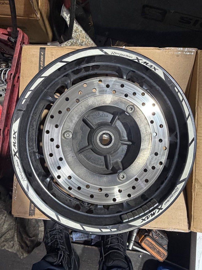 XMAX stock rim (Category: Motorcycle Accessories) located in Singapore. Submitted by s_xuan (Listing ID 1458041609, Image 6). Description: - Genuine XMAX stock rim - Includes brake disc - Ready for installation - Disc and tyres not included no major scratches on the outside rims are at workshop (lianhupsengkee) for easy installation.