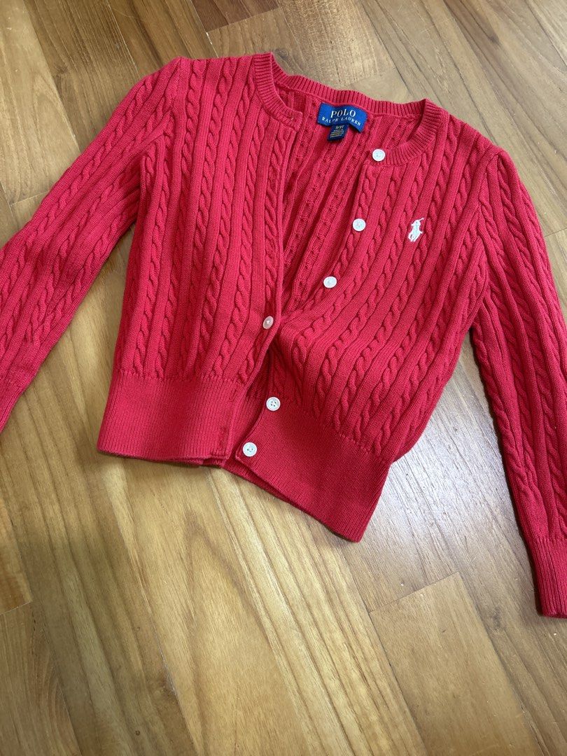 Polo Ralph Lauren Red Cable Knit Cardigan 3/3T (Category: Babies & Kids Fashion) located in Singapore. Submitted by decluttering_____ (Listing ID 1458186816, Image 1). Description: - Cute red cable knit cardigan - Brand: Polo Ralph Lauren - Features classic pony logo embroidered on chest - Button front closure - Perfect for layering - Size: 3/3T - Hardly worn - Self collect or top up $3 for tracked mail.