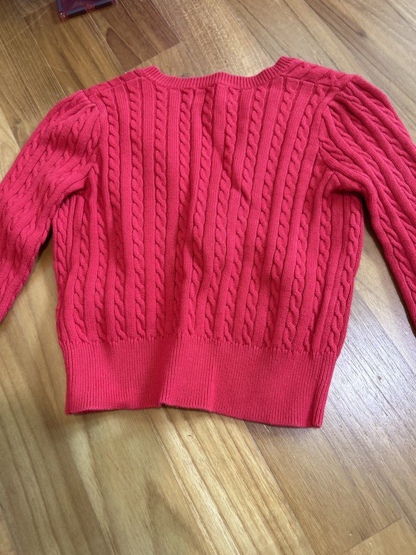 Polo Ralph Lauren Red Cable Knit Cardigan 3/3T (Category: Babies & Kids Fashion) located in Singapore. Submitted by decluttering_____ (Listing ID 1458186816, Image 3). Description: - Cute red cable knit cardigan - Brand: Polo Ralph Lauren - Features classic pony logo embroidered on chest - Button front closure - Perfect for layering - Size: 3/3T - Hardly worn - Self collect or top up $3 for tracked mail.