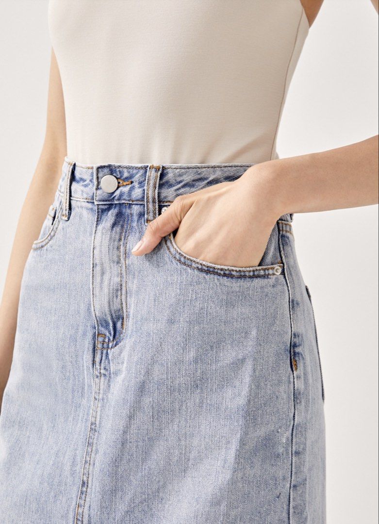 Love, Bonito Light Wash Denim Midi Skirt with Front Slit (Category: Skirts) located in Singapore. Submitted by yapleehyun (Listing ID 1453523287, Image 3). Description: - Classic light wash denim midi skirt - Front slit for easy movement - Two front pockets - Two back pockets - Button and zip closure - Versatile wardrobe staple.