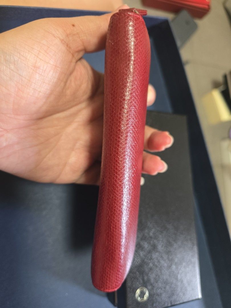 Authentic Montblanc Sartorial Leather Single Pen Pouch (Red / Cassis) - Full Set (Category: Accessories) located in Singapore. Submitted by shopsprees (Listing ID 1458526549, Image 5). Description: - Set of 2 red leather pen cases - Includes original Montblanc boxes - Features a nice leather texture - Secure zipper closure for both cases - Ideal for protecting and organizing your pens - Feel free to ask any questions! 1 for $300.