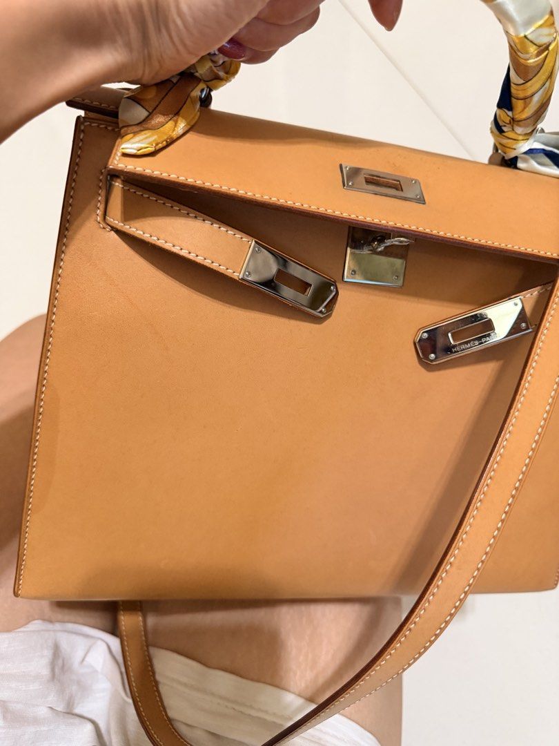 Hermès Kelly 28 Sellier Chamonix | PHW (Category: Bags & Wallets) located in Singapore. Submitted by madshopaholic (Listing ID 1453633855, Image 7). Description: * Hermès Kelly 28 Sellier * Chamonix leather * Palladium Hardware (PHW) * Lock & keys included * Shoulder strap included * Excellent overall condition with light signs of careful use(some water marks) * Beautiful leather with a timeless, elegant look This is a classic Kelly 28 in Chamoni
