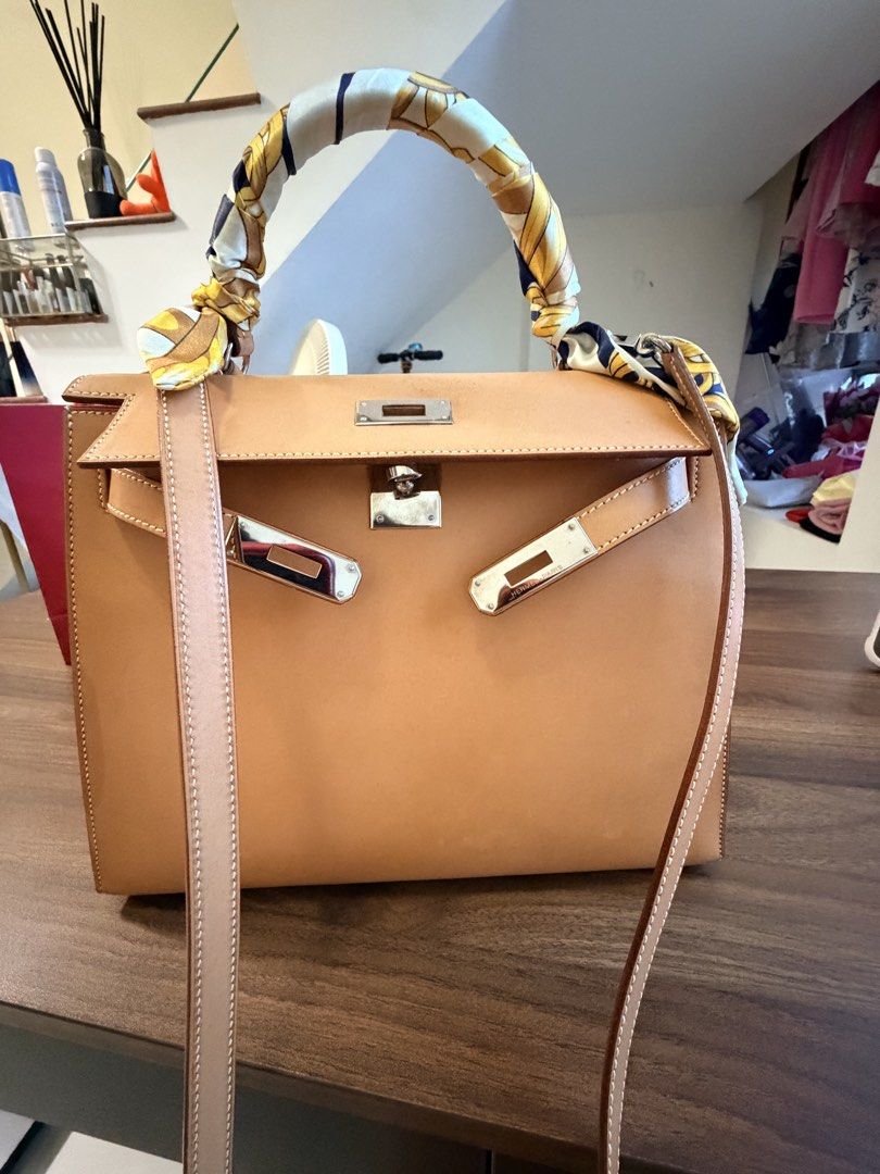 Hermès Kelly 28 Sellier Chamonix | PHW (Category: Bags & Wallets) located in Singapore. Submitted by madshopaholic (Listing ID 1453633855, Image 1). Description: * Hermès Kelly 28 Sellier * Chamonix leather * Palladium Hardware (PHW) * Lock & keys included * Shoulder strap included * Excellent overall condition with light signs of careful use(some water marks) * Beautiful leather with a timeless, elegant look This is a classic Kelly 28 in Chamoni