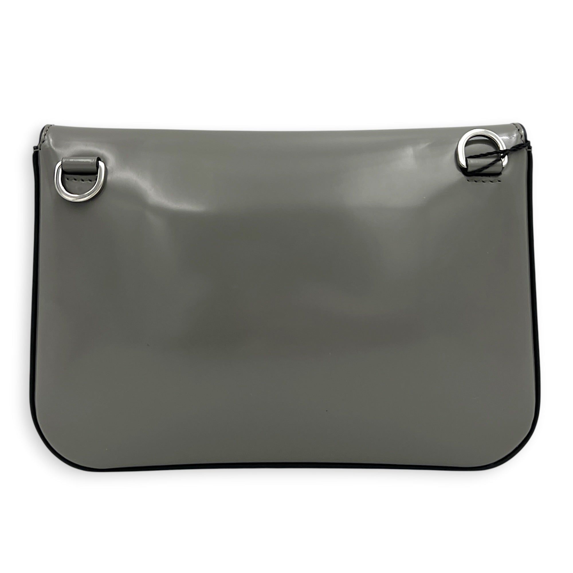 Prada Logo Crossbody Bag Grey in Patent Leather, Silver hardware (Category: Bags & Wallets) located in Singapore. Submitted by carousellluxury (Listing ID 1433497755, Image 2). Description: SKU C2604-011345AA Material Patent Leather Color Grey Hardware Silver Strap Included, detachable Dimension (L)18cm x (H)10cm x (W)7cm Accessories Dust Bag, Series 7/K Circa Est NA Microchipped FALSE Condition - Surface: In very good condition overall - Bottom 